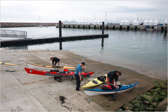 There is a spanking new marina next to the ferry terminal in Roscoff... ideal for launching a sea kayak.. until a port official comes along and insists "eet eez not allowed".. later found out there is some by-law that says if you haven't got an engine or sails then sea kayaking in the area is strictly "interdit"... thus necessitating unpacking and reassembling trolleys for a 1km trudge around the headland to the beach.