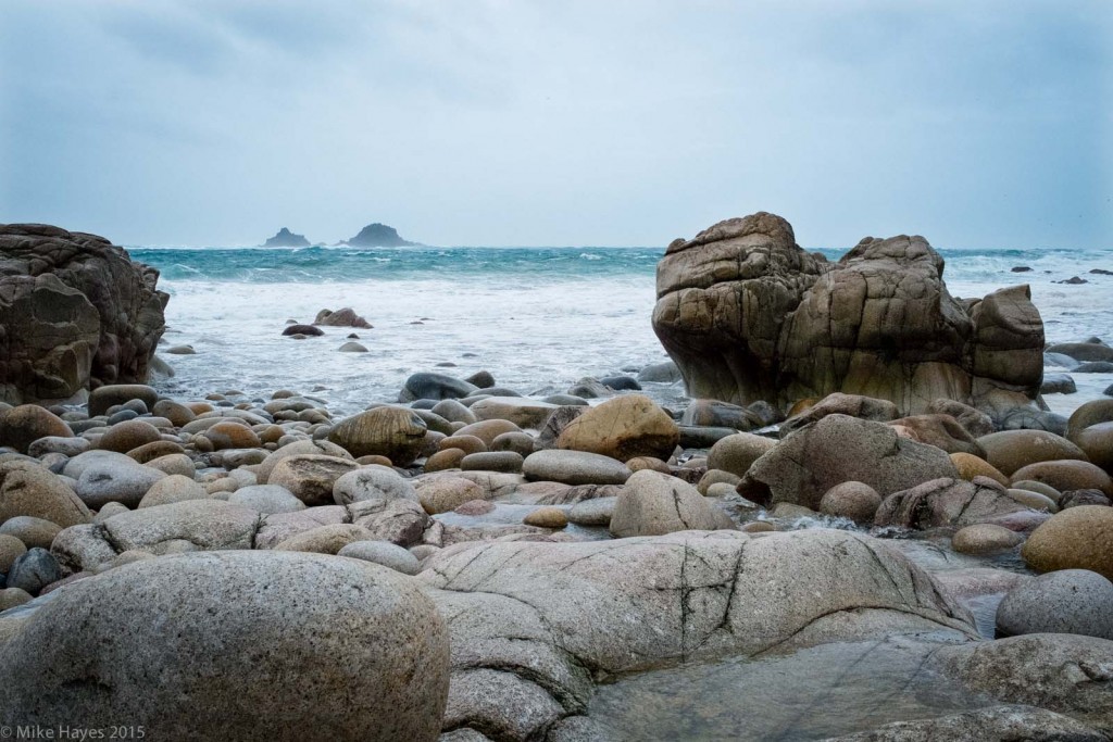 Brisons from Porth Nanven Looking out to the Brisons from Porth Naven on a wet and windy Sunday afternoon. No kayaking - F7-8 winds and seas of around 20ft meant bicycle and boots only. I'd gone down to check out cheeky wild camp opportunities, as it happens there aren't really any.. but it's a lovely spot regardless with the hard granite sculpted into beautifully rounded shapes by the incessant pounding of the Atlantic.