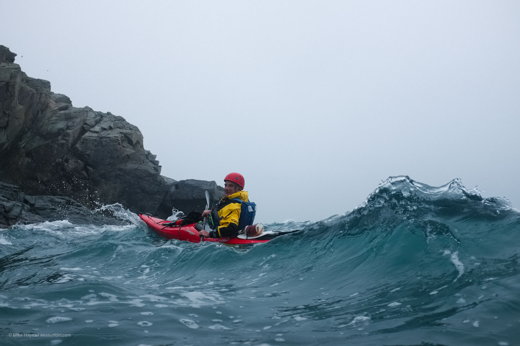 sea kayaker in waves, Cornwall