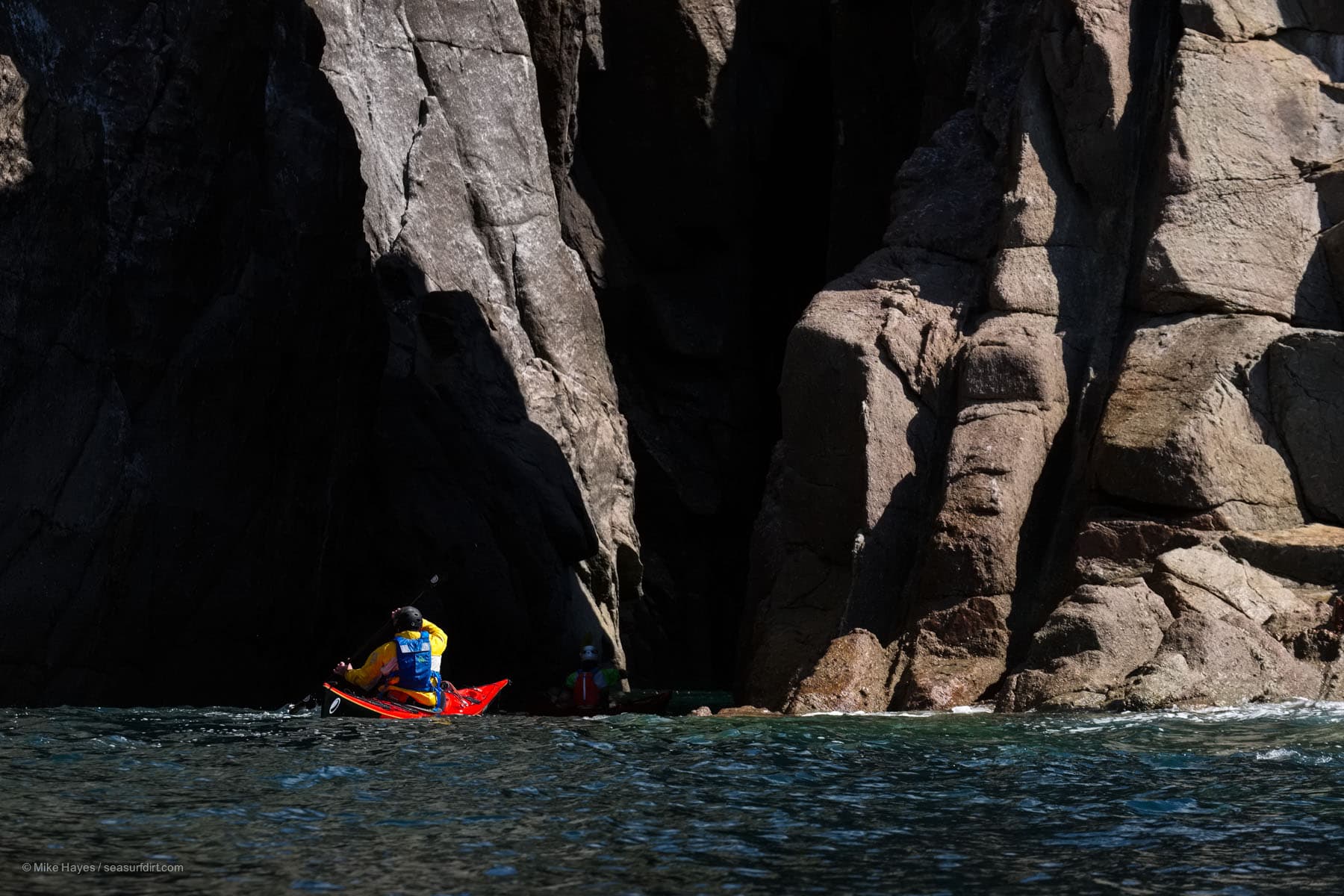 Sea kayaking caves in the granite cliffs of west Cornwall