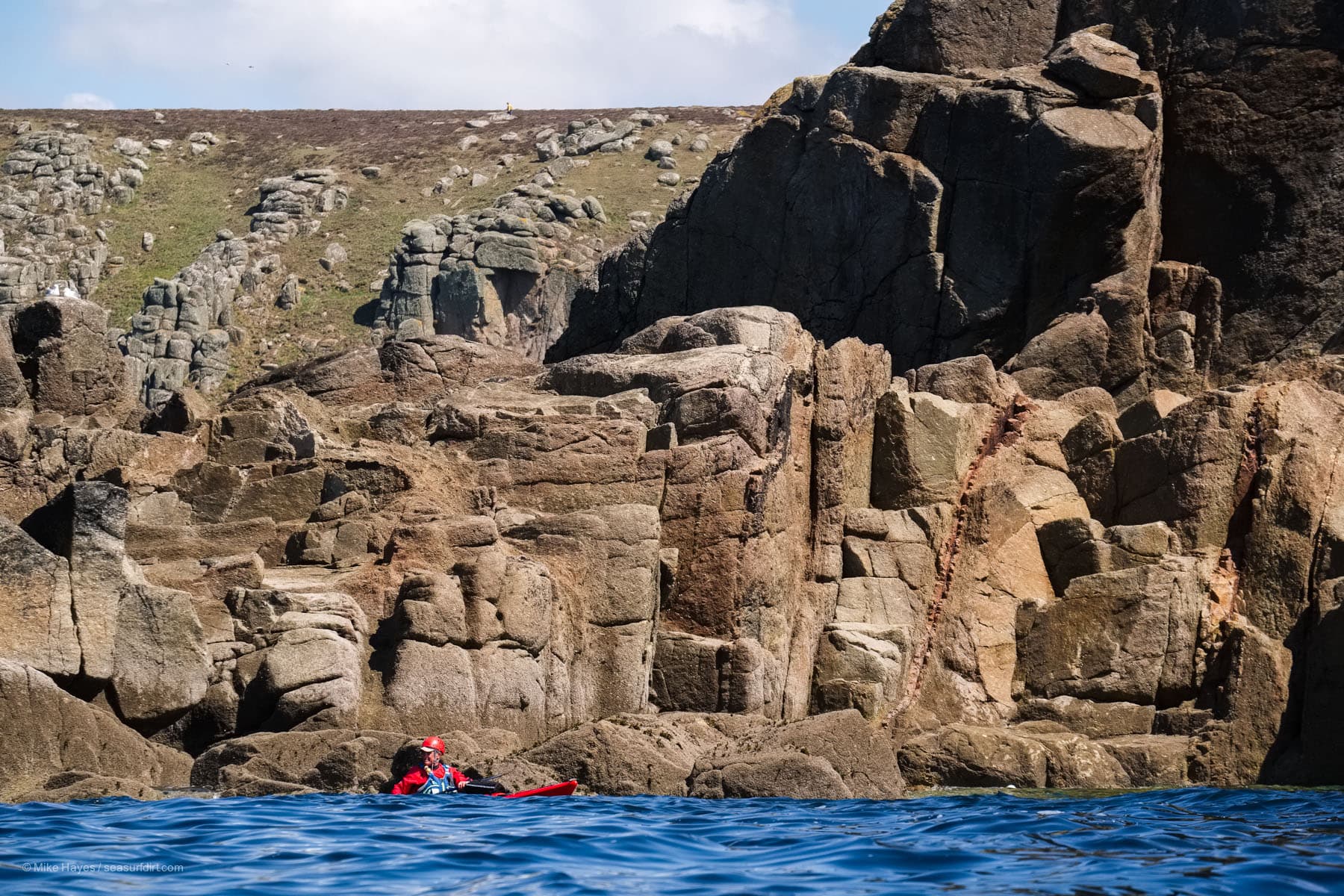 sea kayaker near Nanjizal, west Cornwall