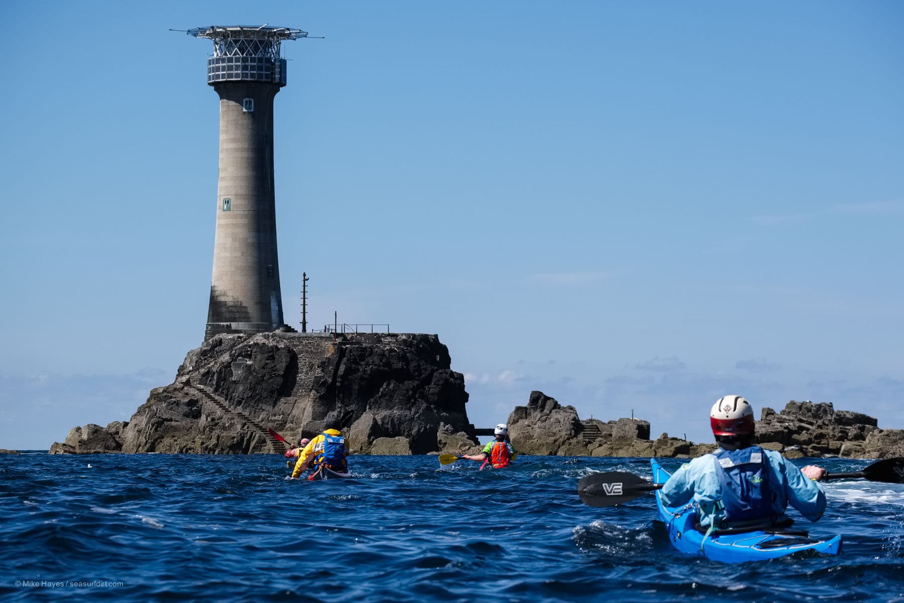 Longships lighthouse and sea kayakers